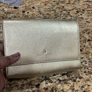 Gold Kate Spade clutch